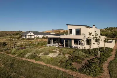 an aerial view of a house in a field at Benguela Cove - Milk and Honey in Hermanus