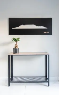 a console table with a plant on top of it at The Fuchsia Collection in Somerset West