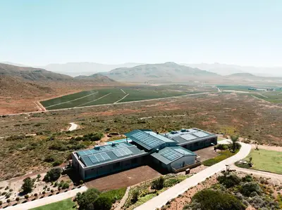 an aerial view of a house with solar panels on it at Khanyisa Mountain Lodge in Robertson
