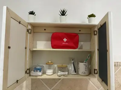 a wooden cabinet with a red bag on it at The Silhouette - Paarl - Self Catering Apartment in Paarl