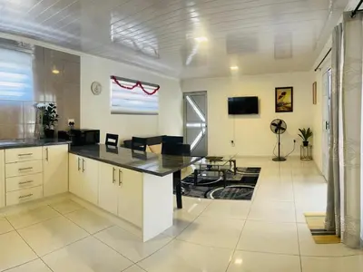 a kitchen with a large island in a room at The MK House in Cape Town
