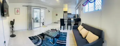 a living room with a couch and a table at The MK House in Cape Town