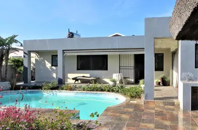 a house with a swimming pool in front of it at Tucker's Self Catering Flatlet in Cape Town