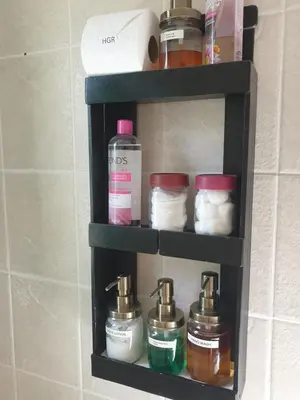 a shelf in a bathroom with jars on it at Hibiscus B&B in Strand