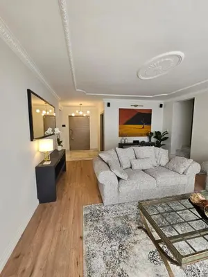 a living room with a couch and a table at Casa La Vista in Somerset West