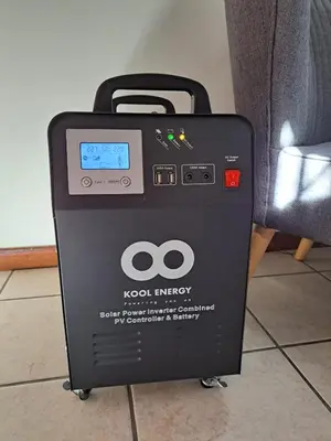 a kodak energy machine sitting next to a couch at Casa Table View in Cape Town