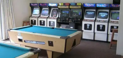 a pool table in front of a row of slot machines at Hermanus Beach Club 143 in Hermanus