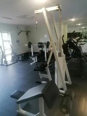 a room with a gym with several tread machines at Hermanus Beach Club 143 in Hermanus