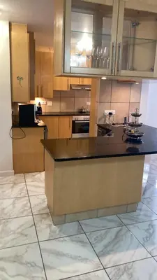 a large kitchen with a large island in the middle at Hibernian 10.02 in Cape Town