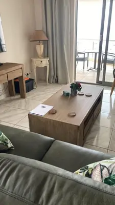 a living room with a couch and a coffee table at Hibernian 10.02 in Cape Town