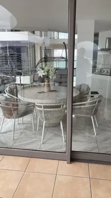 a table and chairs with a table and a dining room at Hibernian 10.02 in Cape Town