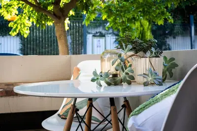 a table with potted plants on top of it at Apartment in central Stellenbosch in Stellenbosch