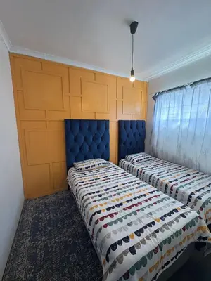 two beds sitting next to each other in a room at Serenity Hideaway in Cape Town