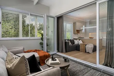 a living room with a couch and a table at The Oak Suite - 7 on Murray Historic Stellenbosch in Stellenbosch