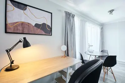 a home office with a desk and chairs at The Rondebosch Views in Cape Town