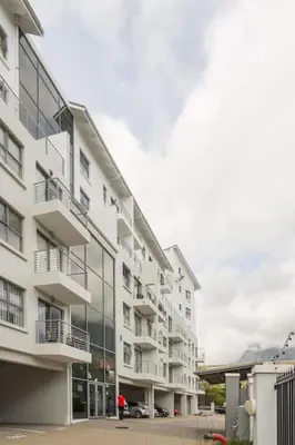 a building with a person standing in front of it at The Rondebosch Easy Living in Cape Town