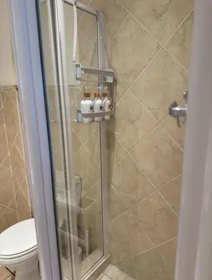 a shower stall with a toilet in a bathroom at The Muscadel - Paarl - Self Catering Apartment in Paarl