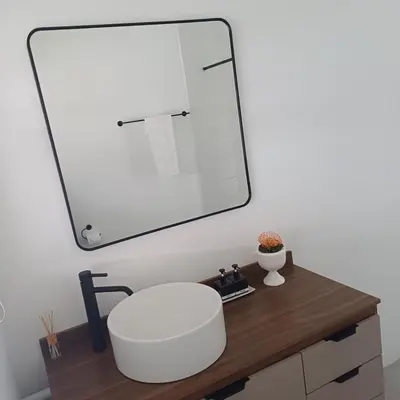 a bathroom with a sink and a mirror at Lanaria 9, Betty's Bay in Clareport