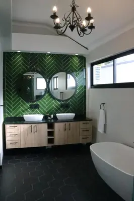 a bathroom with two sinks and a tub and a mirror at Villa Des Roses in Paarl