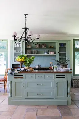 a kitchen with green cabinets and a large island at Moya's Vineyard in Mosselrivier