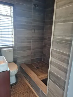a bathroom with a shower with a toilet at SharronDeez in Cape Town