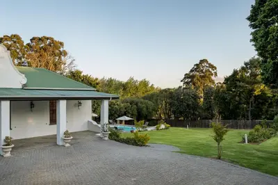 a house with a green roof and a driveway at La Felicita Boutique Self Catering Villas in Somerset West