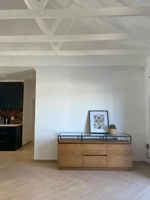 a room with a desk with a picture on it at Chasselas Self Catering in Cape Town