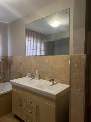 a bathroom with a sink and a mirror at STAY In TEHAMA in Cape Town
