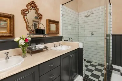 a bathroom with two sinks and a shower at Franschhoek villa in Franschhoek