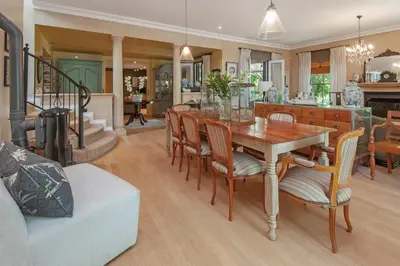 a kitchen and dining room with a table and chairs at Franschhoek villa in Franschhoek