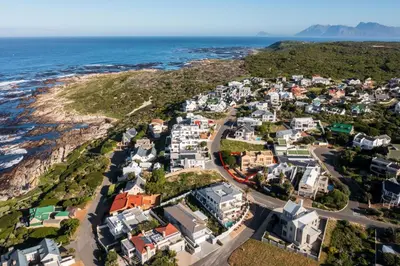 an aerial view of a small town next to the ocean at Ocean View living in Hermanus