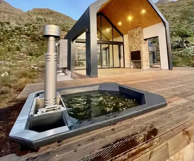 a pool of water in front of a house at The Unbound - Escape the Ordinary in Romansrivier