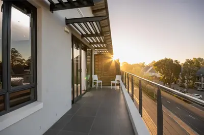 a balcony of a house with a view of a street at 309 on Titanium in Cape Town