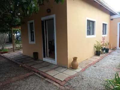 a house with a vase sitting outside of it at The Haven Hide-Away in Fisherhaven