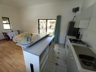 a kitchen with a counter and a stove top oven at The Haven Hide-Away in Fisherhaven
