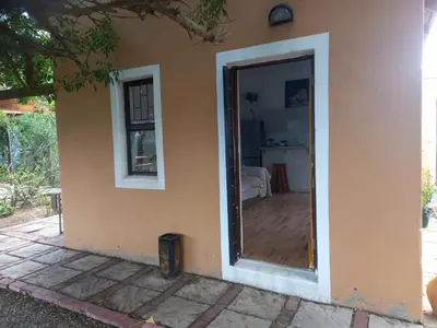 a house with a door open to a room at The Haven Hide-Away in Fisherhaven