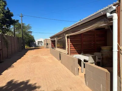 a building with a brick walkway next to a building at The Jack at Marnas Self Catering Accommodation in Cape Town