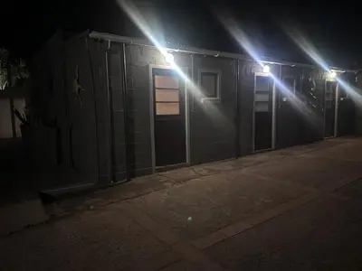 a couple of lights on a building at night at The Jack at Marnas Self Catering Accommodation in Cape Town