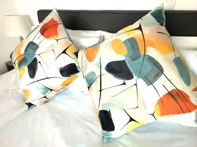 a bed with two pillows on top of it at 404 Horizon Bay in Bloubergstrand