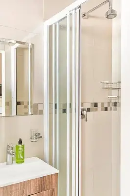 a bathroom with a shower and a sink at Goodwood Oasis Free WiFi-Parking 2 in Cape Town