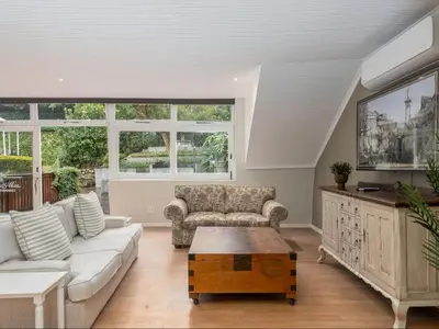 a living room with a couch and a coffee table at Nantes-vue in Paarl