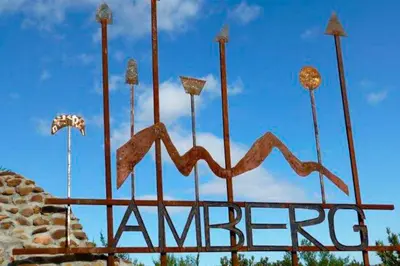 a large sign that says amore on top of a building at Amberg Country Estate in Paarl