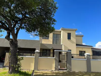 a house with a tree in front of it at Alucia in Cape Town