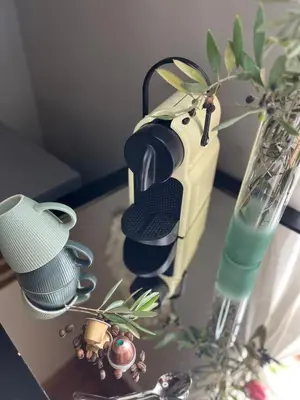 a table with a tea pot and cups and a vase at Hephzibah inn Guest house and venue in Hermon