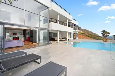 an exterior view of a house with a swimming pool at Restio View 11 in Cape Town