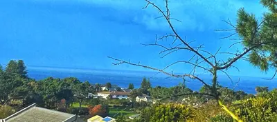 a view of the ocean from a house at Villa Silver Vos in Hermanus