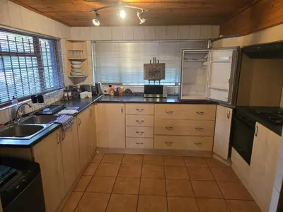 a kitchen with a sink and a counter top at Urban Retreat in Cape Town
