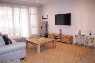 a living room with a couch and a coffee table at 24 Le Bourgette in Franschhoek