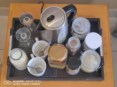 a tray with a pot and a bunch of containers at Spacious Double Room for Two with Pool, Braai, Gas Stove, Complete Kitchen, Fast WiFi and Private Bathroom in Cape Town