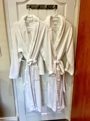 a closet filled with white sweaters on hangers at French Manor 2 Stellenbosch in Stellenbosch